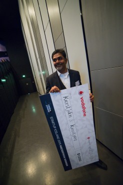 Bala Standing with the SI2015 Hackathon Winner Cheque